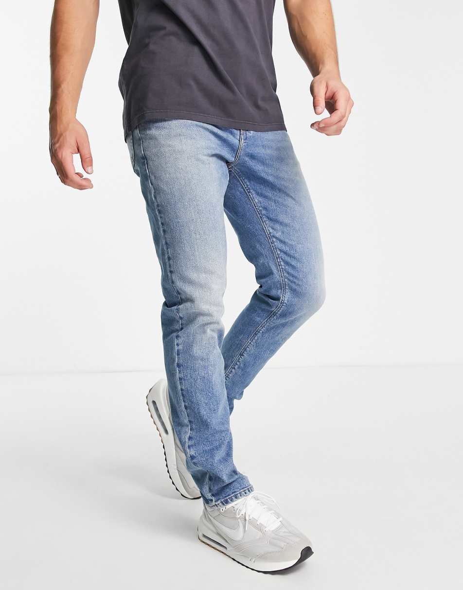ASOS DESIGN stretch slim jeans in vintage mid wash blue
