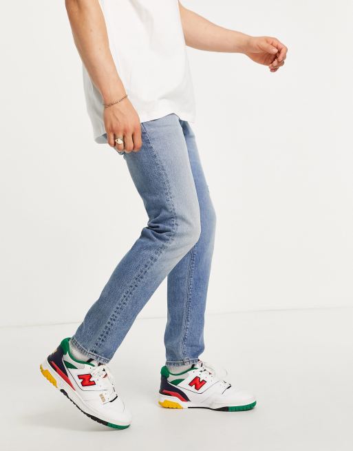ASOS DESIGN stretch slim jeans in vintage mid wash with abrasions