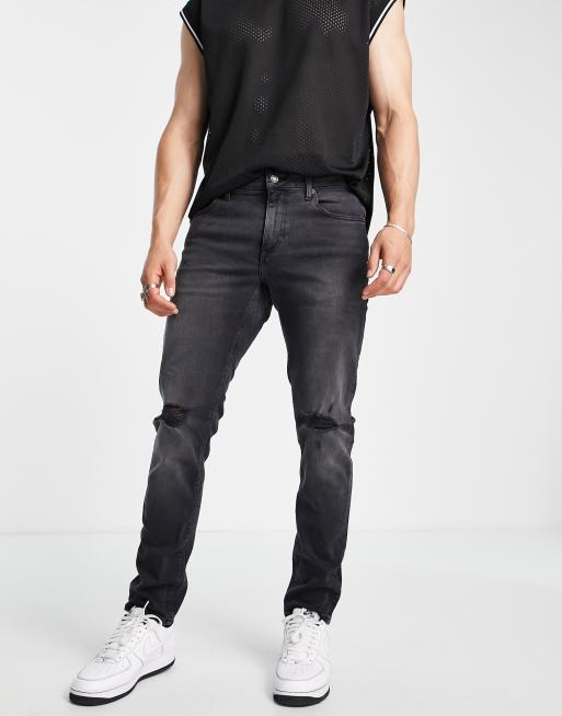 ASOS DESIGN stretch slim jeans in washed black with knee rip