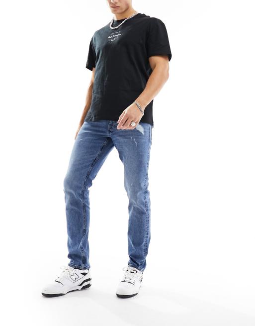 ASOS DESIGN stretch slim jeans with abrasions in mid wash blue