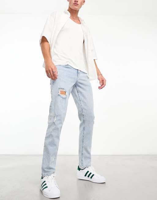 ASOS DESIGN stretch slim jeans with rips in light wash blue ASOS