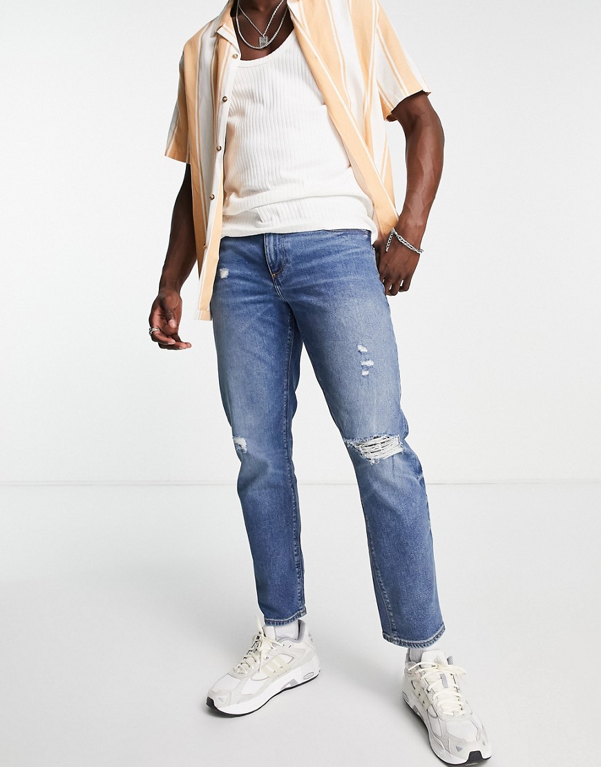 ASOS DESIGN stretch tapered jean in dark wash with knee rip-Blue
