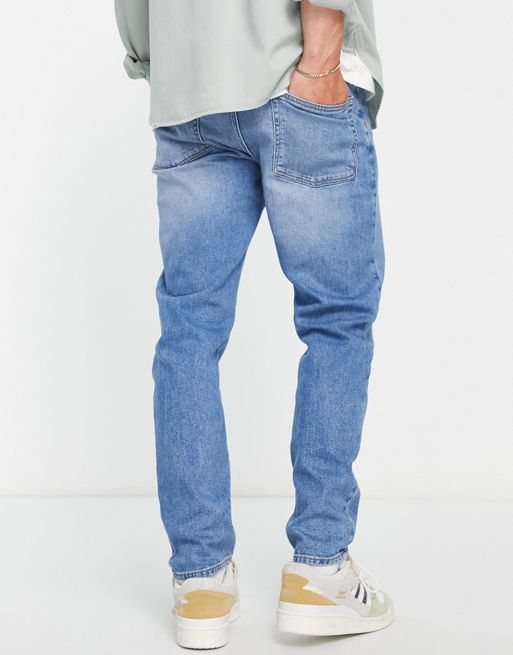 ASOS DESIGN relaxed tapered jeans in vintage mid wash