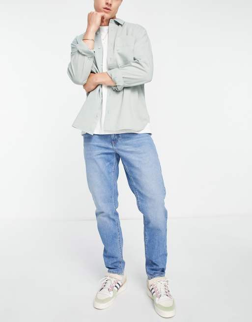 ASOS DESIGN relaxed tapered jeans in vintage mid wash