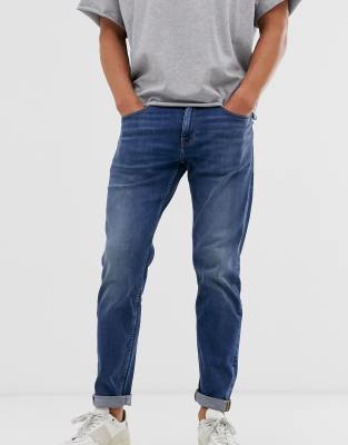 dark blue tapered jeans