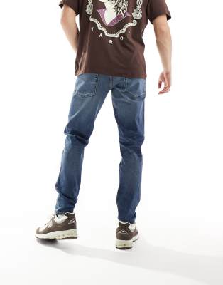 Asos Design Stretch Tapered Jeans In Blue