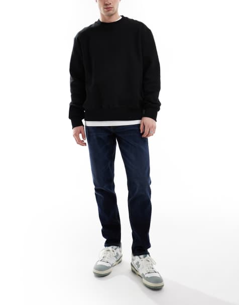 ASOS DESIGN stretch tapered jeans in dark wash - view 1