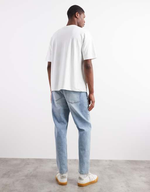 ASOS DESIGN stretch tapered jeans in light wash blue wash, 2 of 5