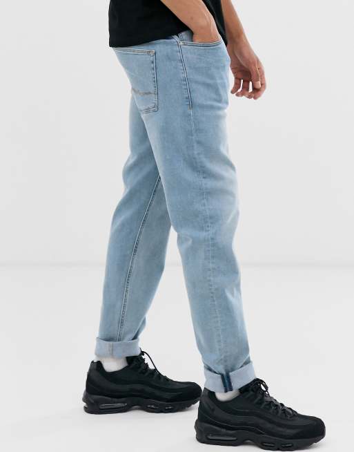 ASOS DESIGN tapered jeans in light wash blue