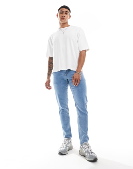 ASOS DESIGN tapered jeans in light wash blue