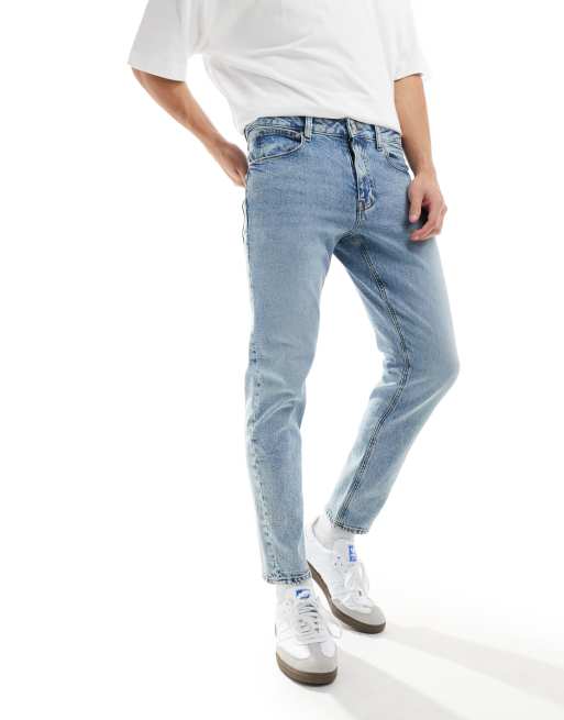 ASOS DESIGN tapered jeans in light wash blue