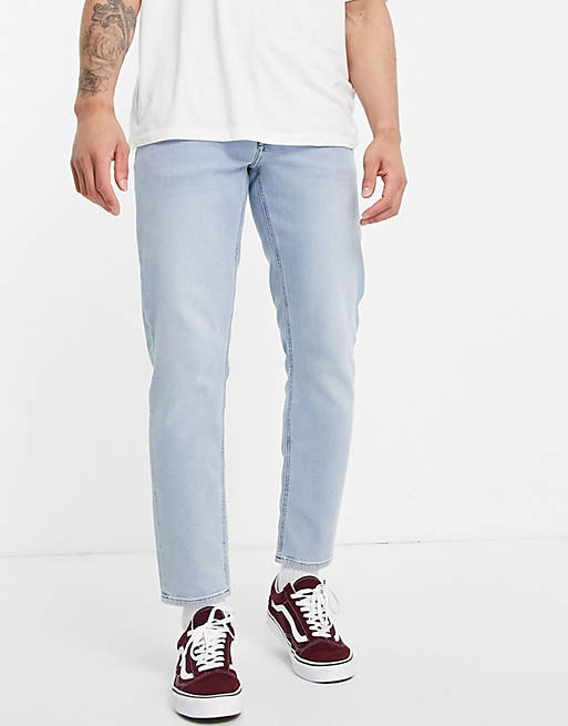 ASOS DESIGN stretch tapered jeans in light wash