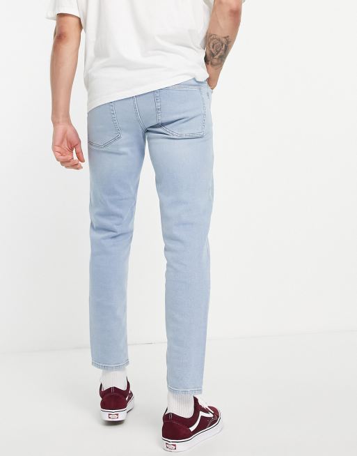 ASOS DESIGN stretch tapered jeans in light wash