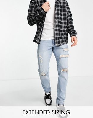 ASOS DESIGN stretch tapered jeans in lightwash with rips