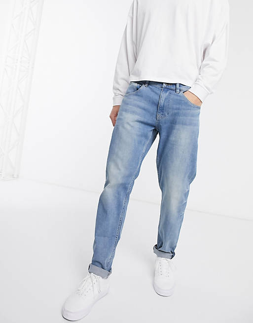 Stretch tapered jeans in mid wash Asos Men Clothing Jeans Stretch Jeans 