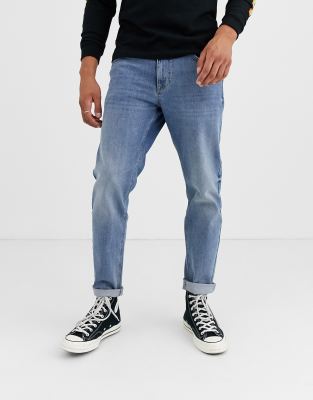 ASOS DESIGN stretch tapered jeans in 