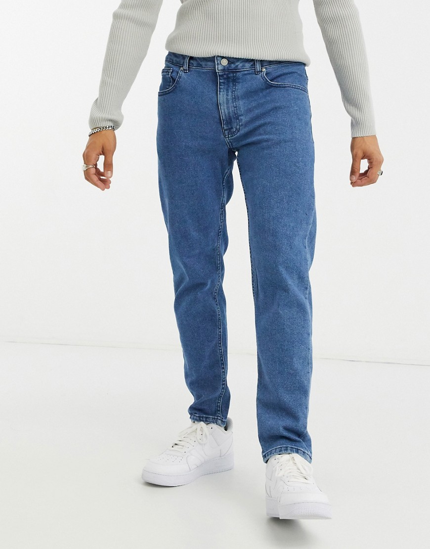 ASOS DESIGN stretch tapered jeans in retro mid wash blue-Blues