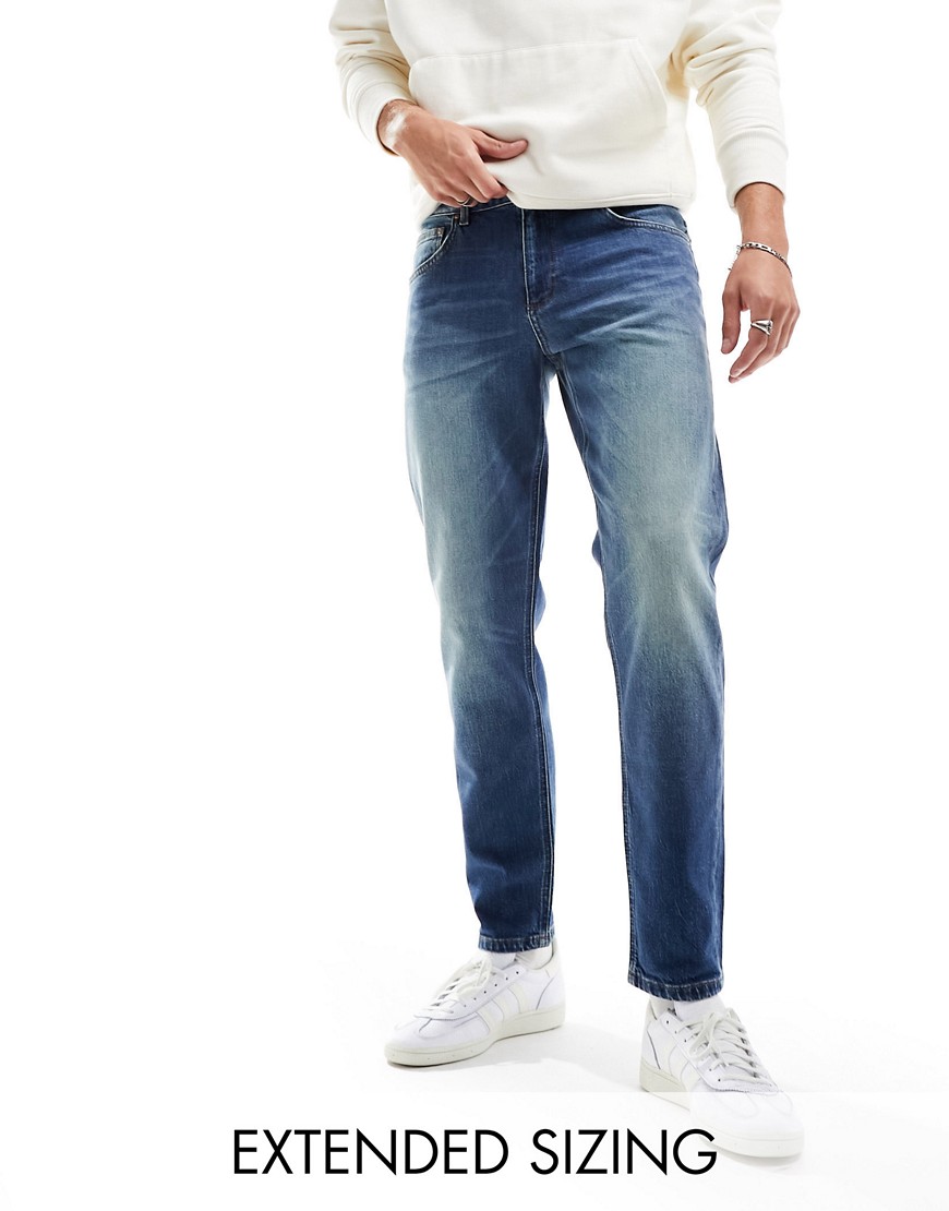 ASOS DESIGN stretch tapered jeans in tinted vintage wash-Blue
