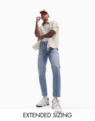 ASOS DESIGN stretch tapered jeans in vintage light wash blue