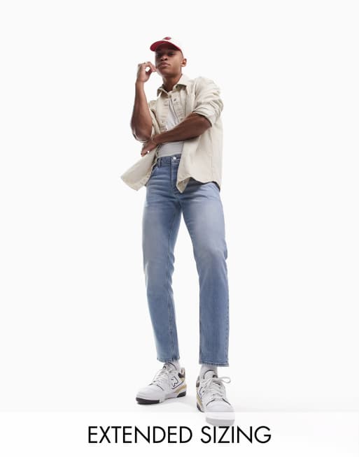 ASOS DESIGN tapered jeans in light wash blue