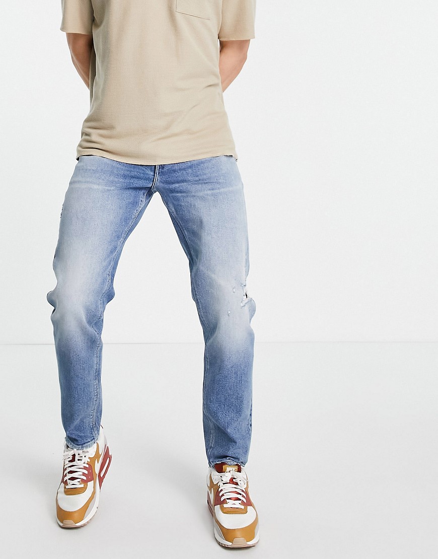 ASOS DESIGN stretch tapered jeans in vintage mid wash with rips-Blues