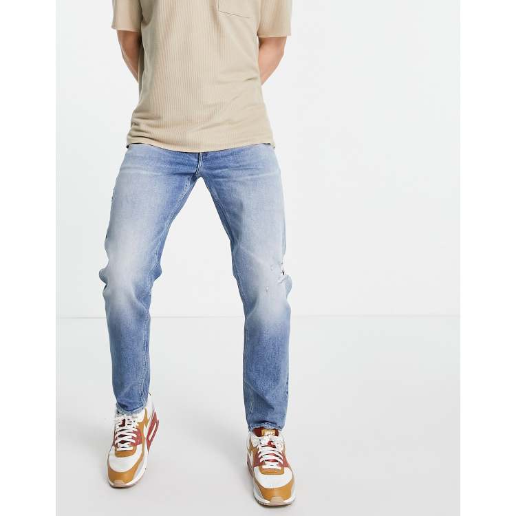 ASOS DESIGN stretch tapered jeans in 90s mid wash