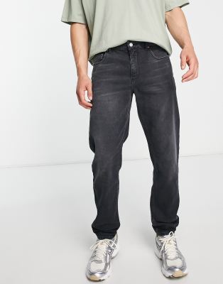 stretch tapered jeans in washed black