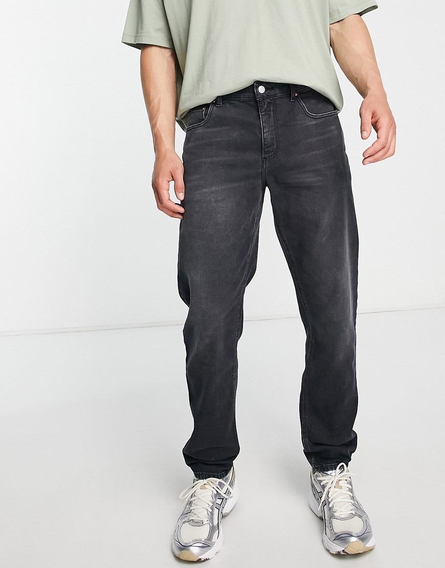 ASOS DESIGN stretch tapered jeans in washed black