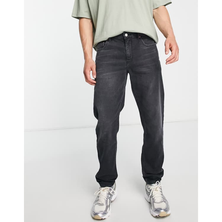 Asos design tapered jeans with curved store seams and belt in washed black