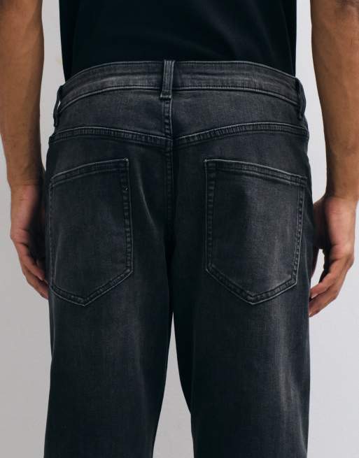 ASOS DESIGN stretch tapered jeans in washed black, 4 of 5