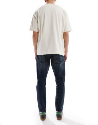 Asos Design Stretch Tapered Jeans With Tint In Blue
