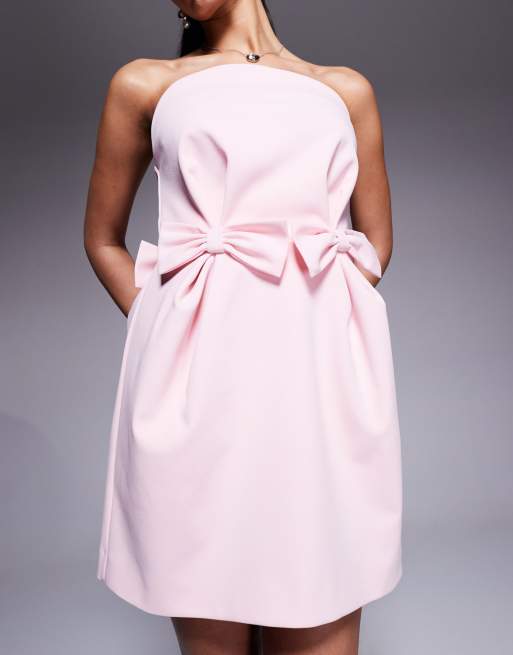 ASOS DESIGN structured curved bodice bow mini dress in pale pink