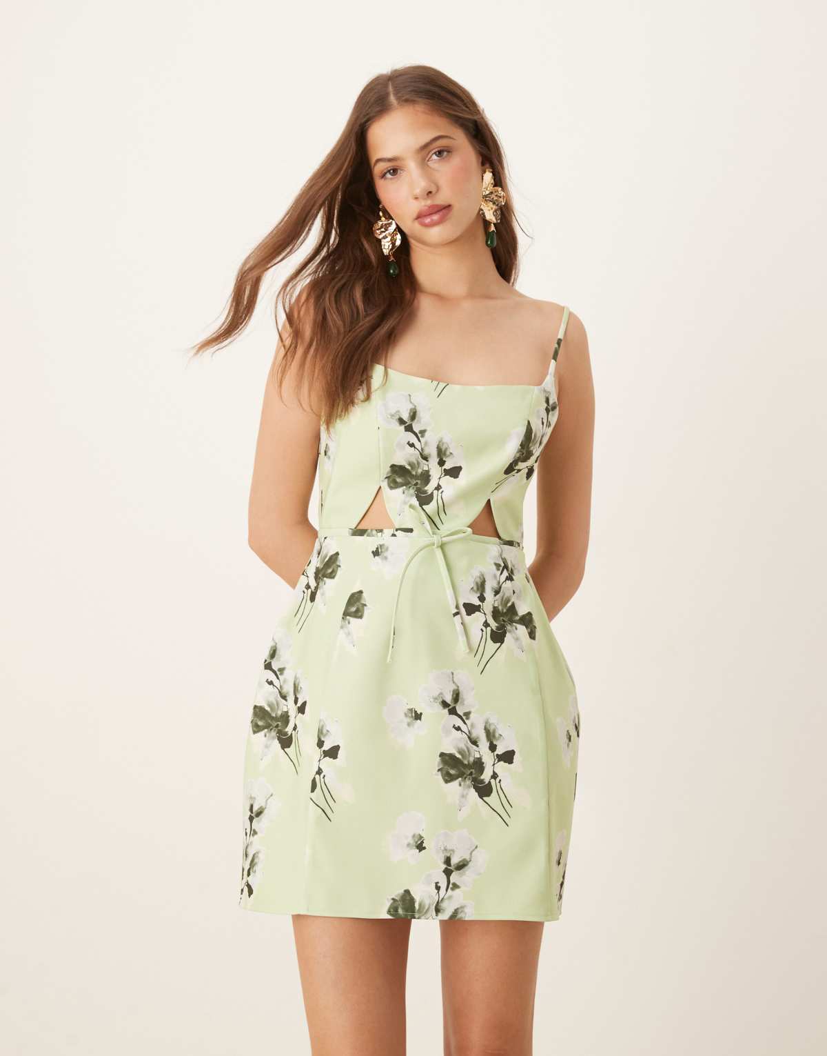 ASOS DESIGN structured cutout mini dress with bow in sage floral print