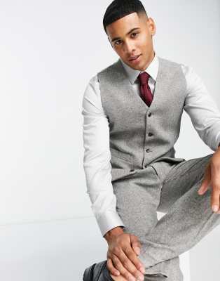 black shirt and grey waistcoat