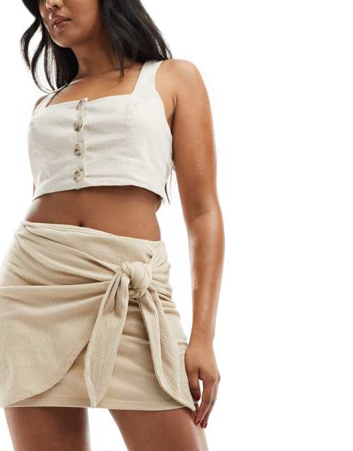 ASOS DESIGN – Strukturierter Minirock in Steinbeige mit gebundener Vorderseite