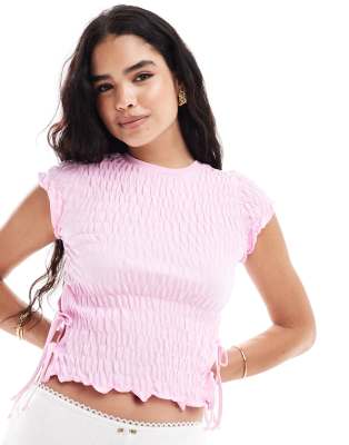 ASOS DESIGN - Strukturiertes, kurzärmliges Oberteil in Rosa mit seitlichen Bindebändern