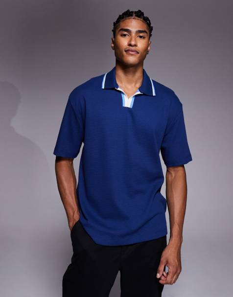 ASOS DESIGN – Strukturiertes Relaxed Fit Polohemd in Blau mit Kontrastkragen - view 1