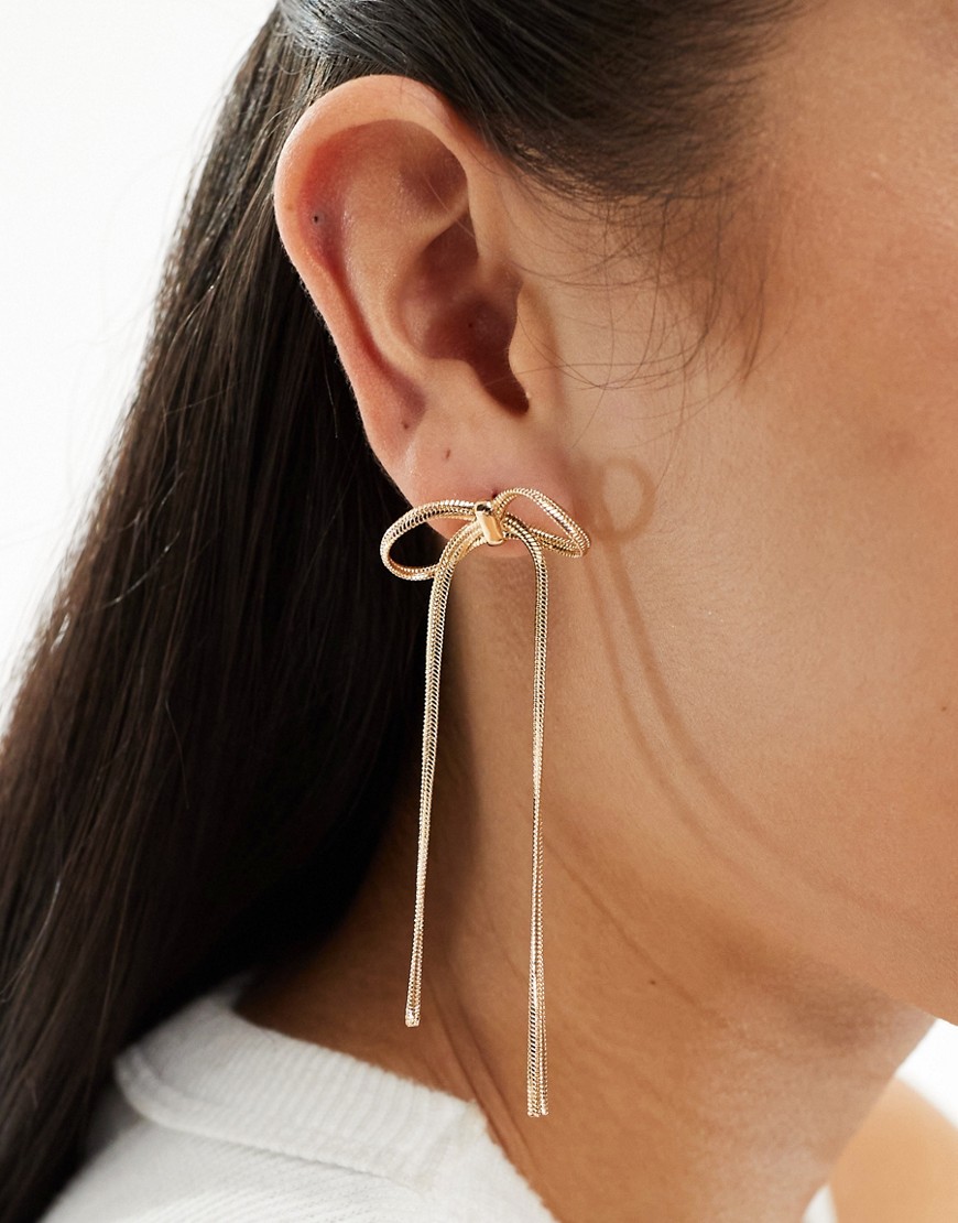 ASOS DESIGN stud earrings with bow chain design in gold tone