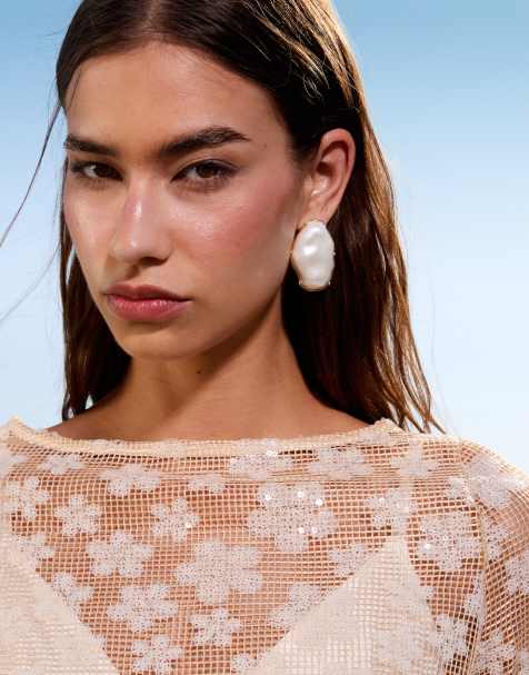 ASOS DESIGN stud earrings with faux pearl design in gold tone - view 1