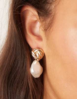 ASOS DESIGN stud earrings with knot detail and faux freshwater pearl drop in gold tone - view 1