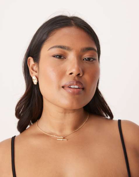 ASOS DESIGN stud earrings with molten design in worn gold tone