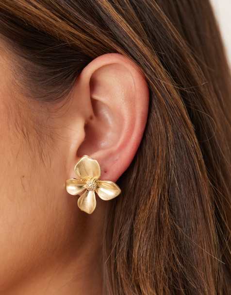 ASOS DESIGN stud earrings with small floral design in worn gold tone - view 1