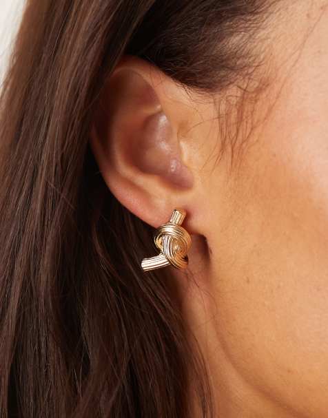 ASOS DESIGN stud earrings with twisted knot design in gold tone - view 1