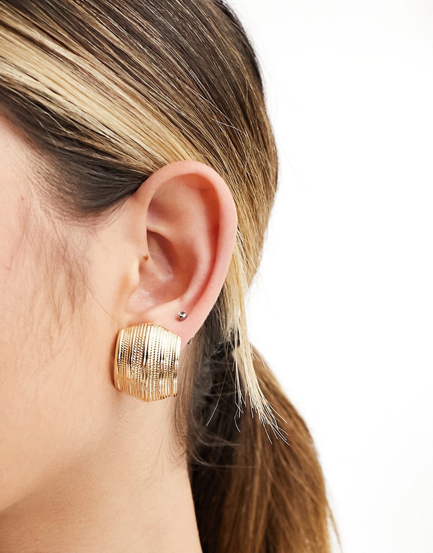ASOS DESIGN stud earrings with vintage look curved ridged detail in gold tone