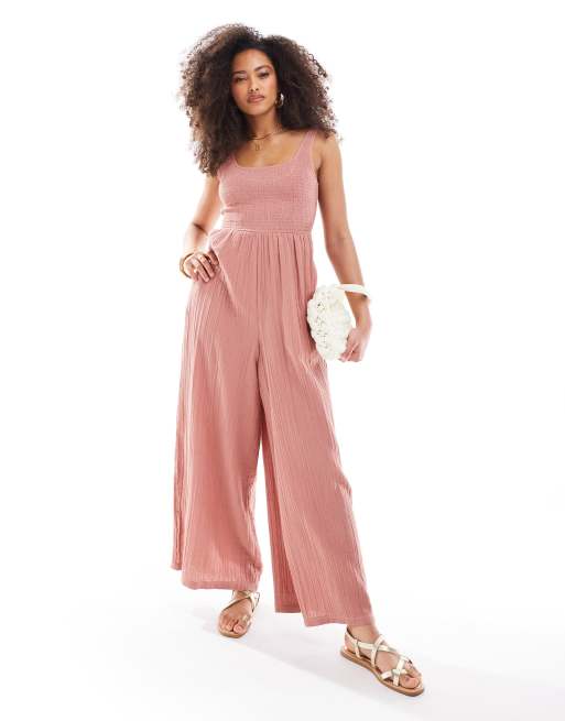 ASOS DESIGN - Støvet rosa jumpsuit med vide ben og dyb rund hals