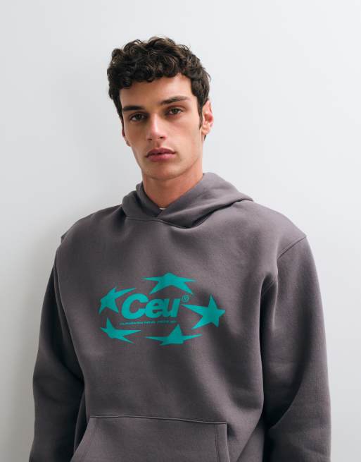 ASOS DESIGN - Sudadera con capucha holgada con estampado gráfico de estrella en gris oscuro, 2 de 5