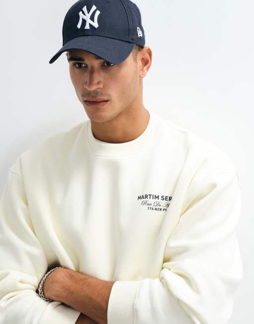 ASOS DESIGN - Sudadera oversize con cuello redondo y estampado gráfico en crudo, 2 de 5
