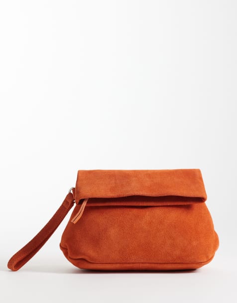 ASOS DESIGN suede clutch bag with fold top detail in orange - view 1