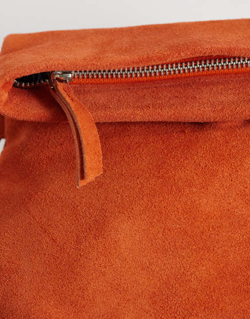 ASOS DESIGN suede clutch bag with fold top detail in orange, 3 of 4
