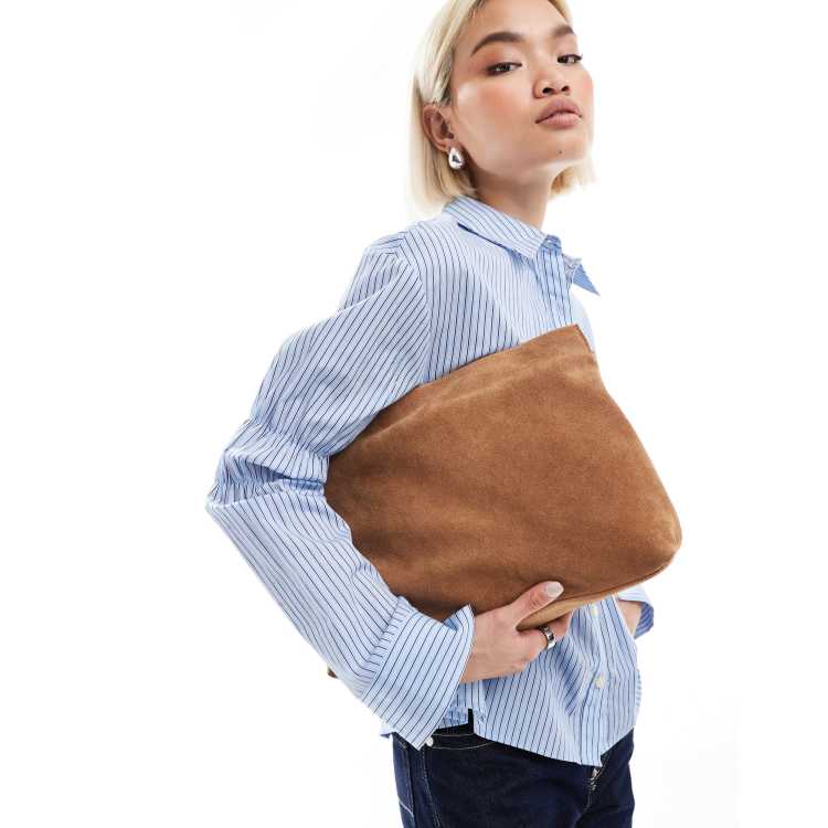 ASOS DESIGN suede oversized clutch in tan ASOS